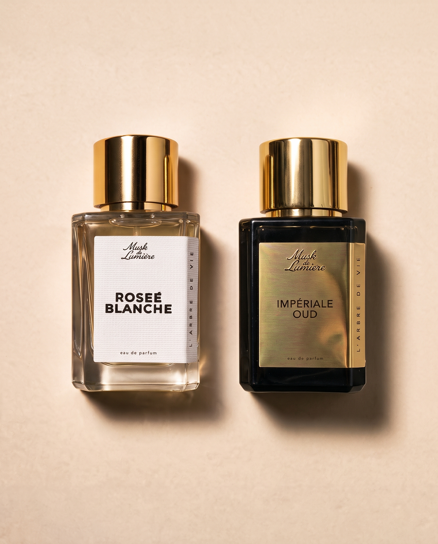 La Rose, deux fois: Roseé Blanche and Impériale Oud, two 50 ml bottles of Musk de Lumière eau de parfum, seen from above